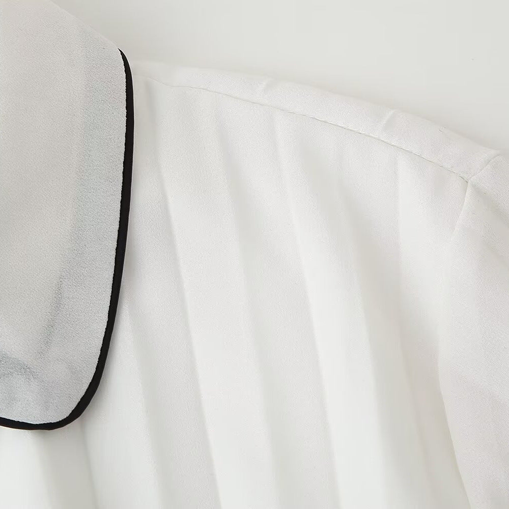 Elegant White Pleated Dress with Black Trim